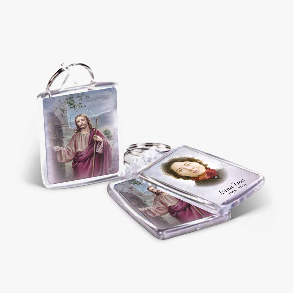 a keychain with a picture of jesus and a woman