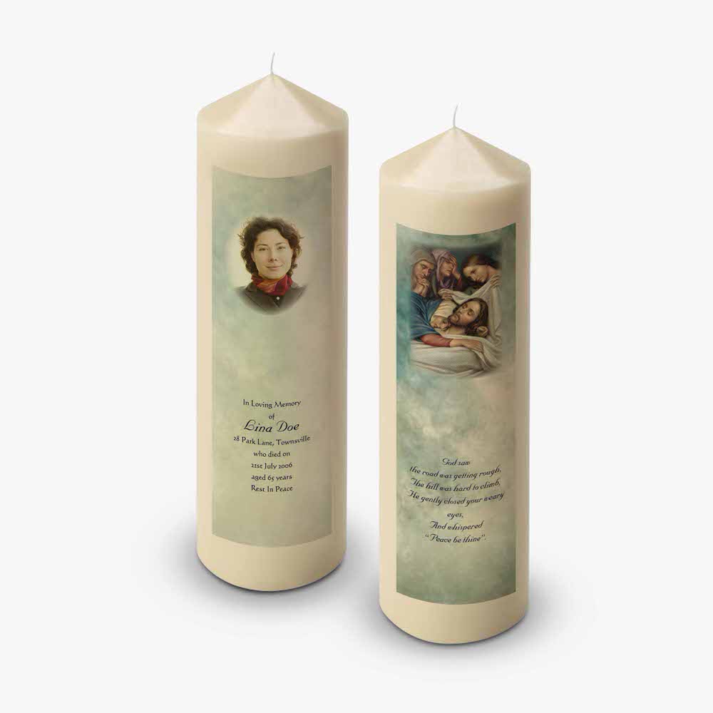 two candles with pictures of a family on them