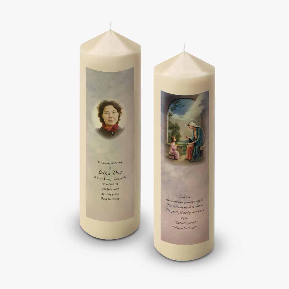 two candles with a picture of a woman and a child