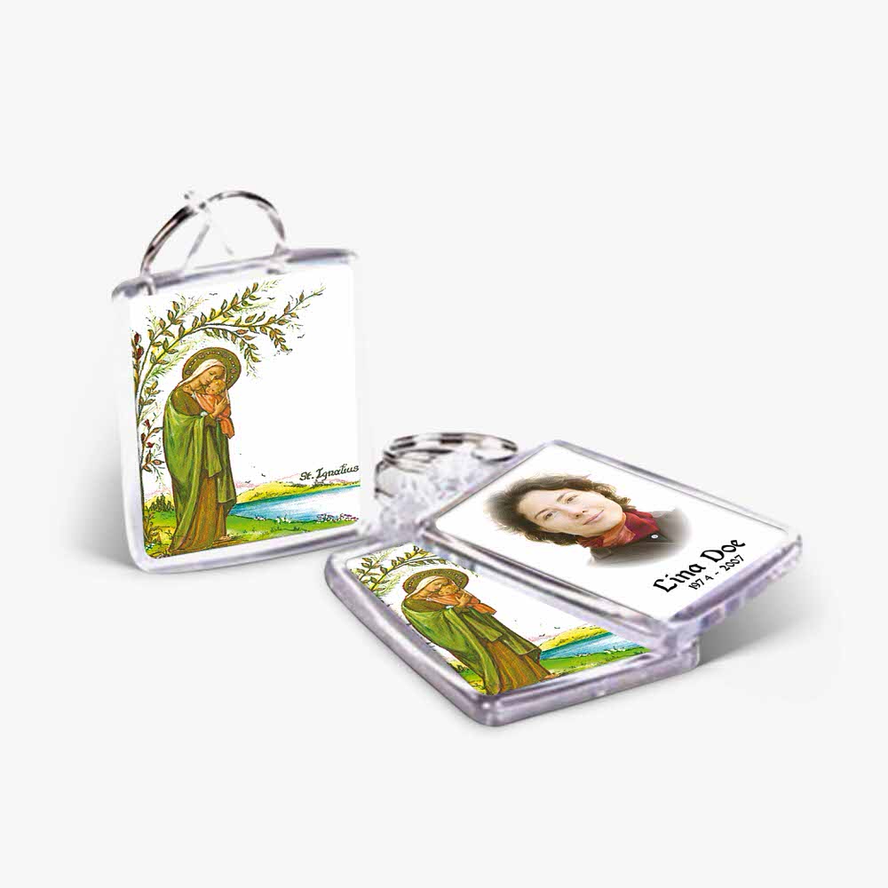 a key chain with a picture of a woman and a tree