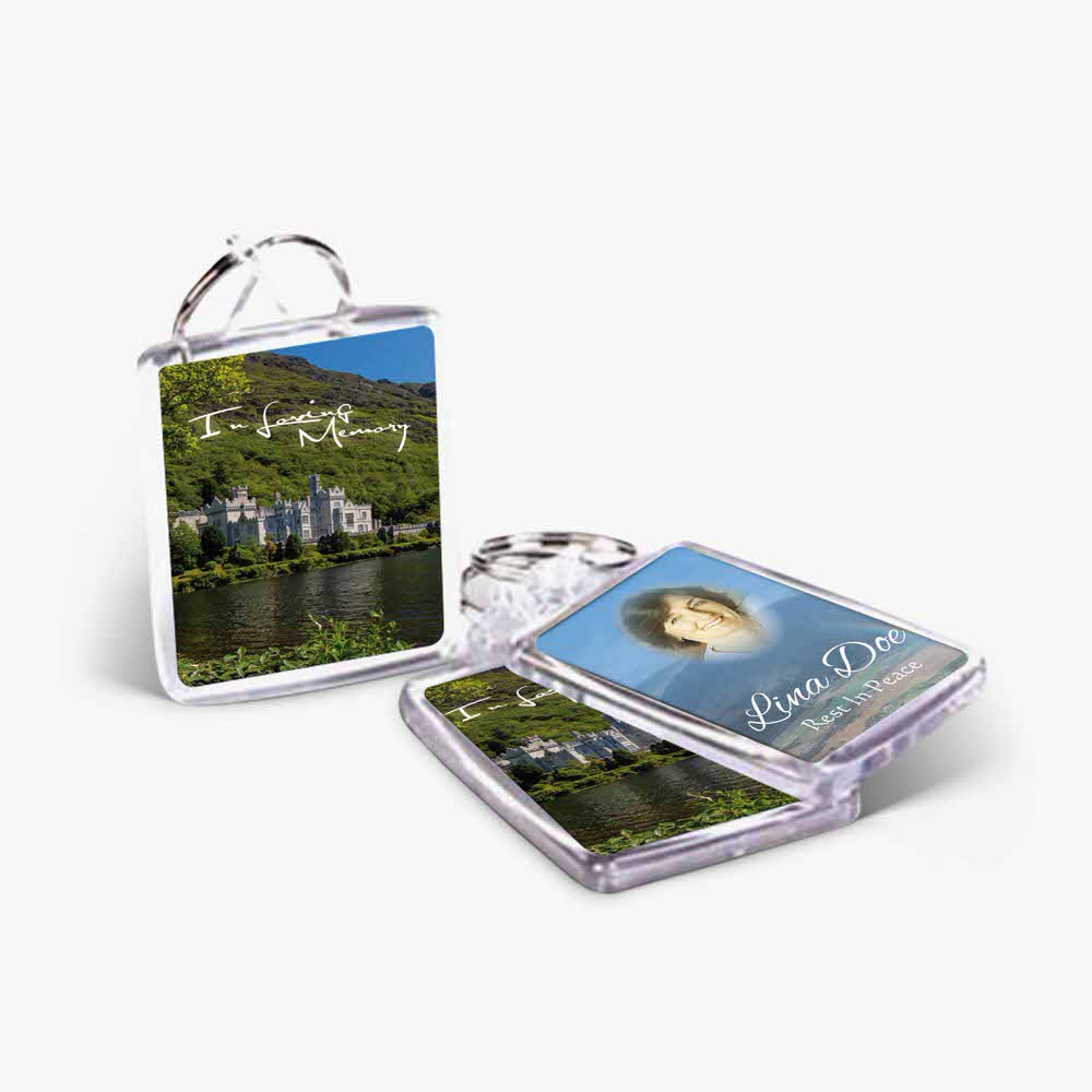 a keyring with a photo of a castle and a picture of a lake