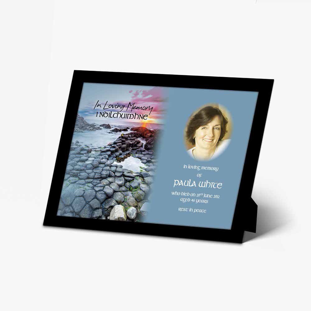a memorial photo frame with a photo of a person on the beach