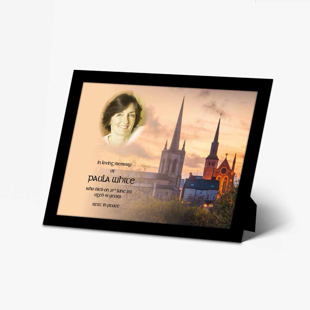 a memorial card with a photo of a church