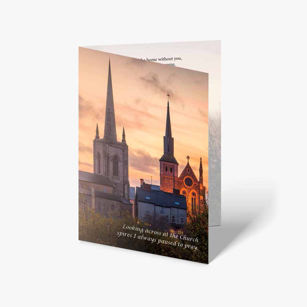a card with a picture of a church and a sunset