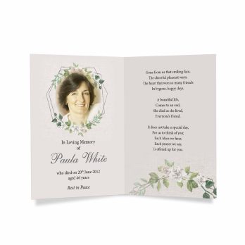 a funeral card with a floral design and a photo of a woman in a green dress