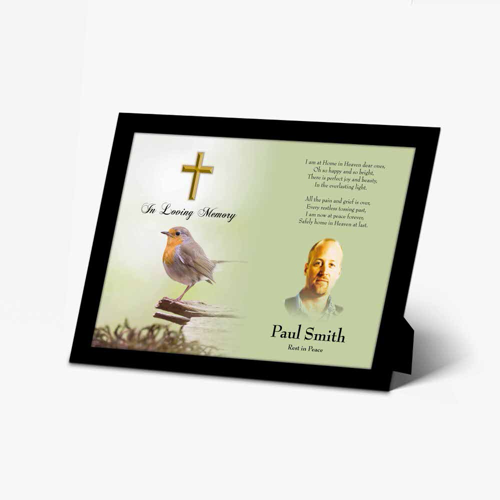 a personalised memorial plaque with a bird on a branch