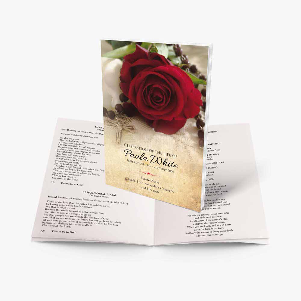 a rose and a rosary in a booklet
