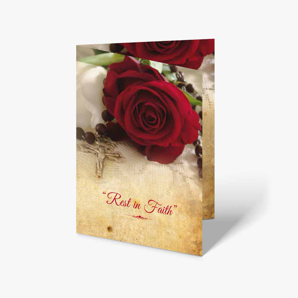 red roses and rosary on a white background