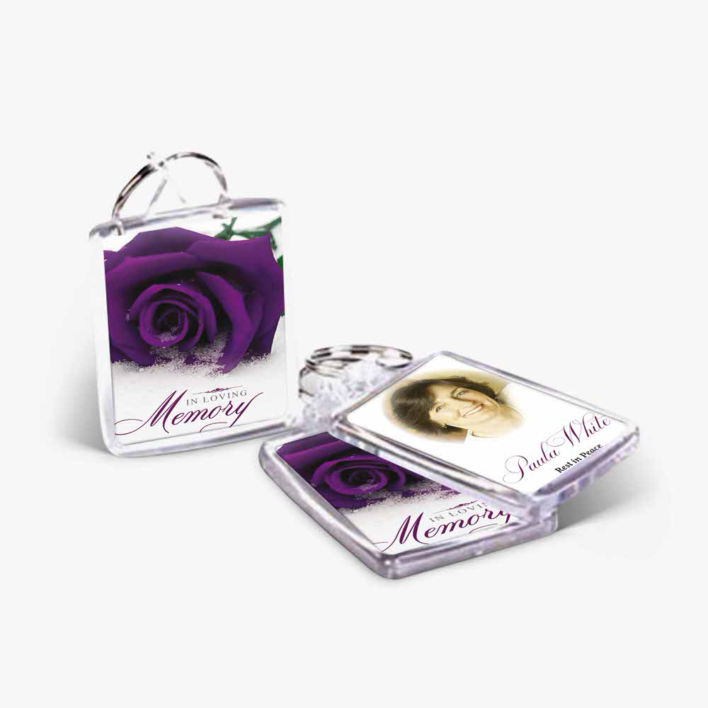a purple rose keychain with a photo and a memory card