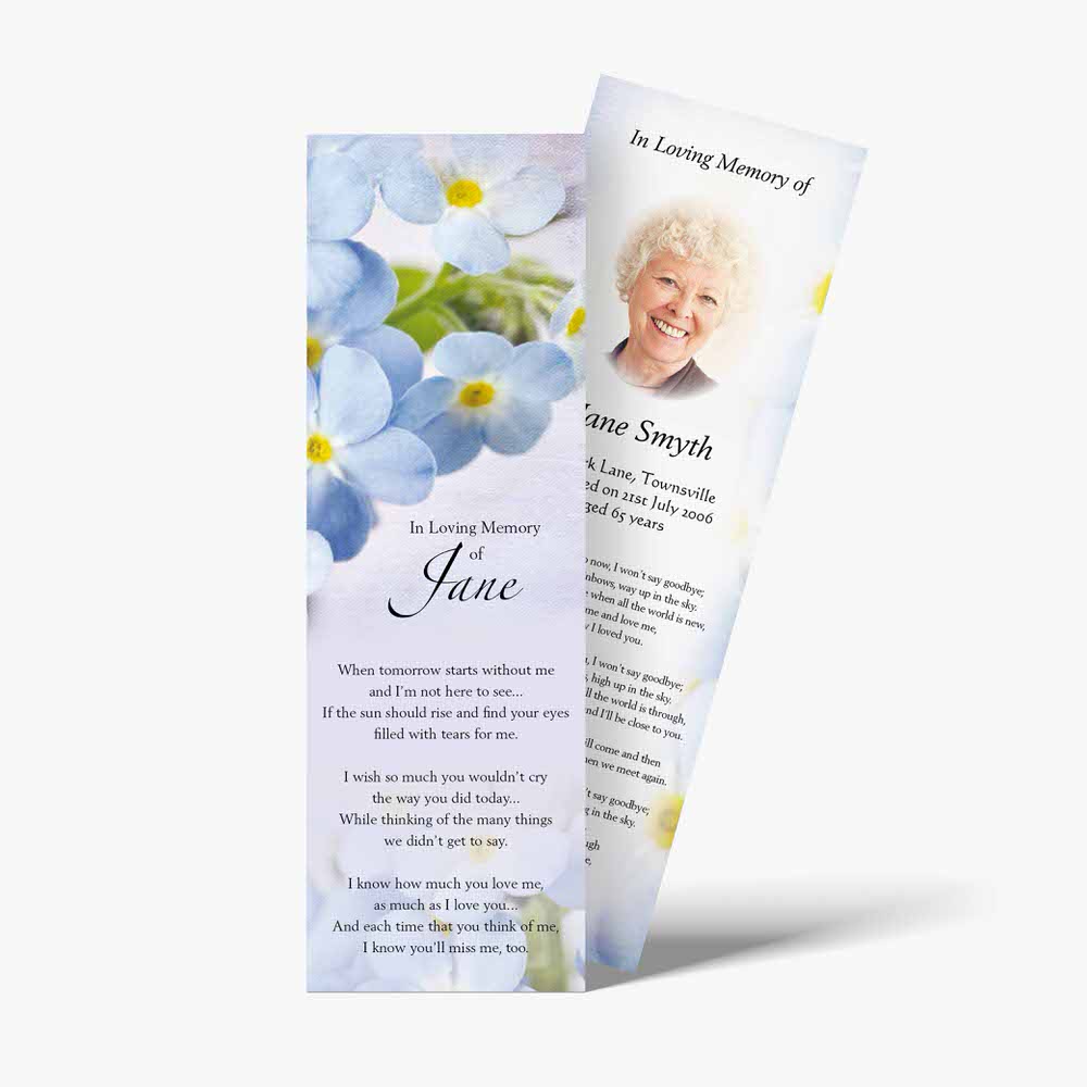 a funeral bookmark with blue flowers and a quote