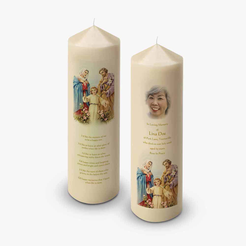 a candle with a picture of jesus and mary